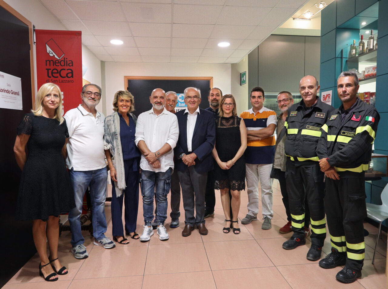 Mediateca San Lazzaro di Savena, Bologna. 2 Agosto 1980-2019 proiezione del documentario PRIMO SOCCORSO sulle spalle dei giganti. Marco Vigna Coordinatore 118 Soccorsi 2 Agosto 1980. Pietro Giurdanella Presidente Ordine Professioni Infermieristiche Bologna. Riccardo Lenzi Presidente Associazione Piantiamo la Memoria. Paolo Sacrati Associazione tra i familiari delle vittime della strage alla stazione di Bologna del 2 Agosto 1980. Benedetta Simon Vicesindaco di San Lazzaro. Agide Melloni, autista autobus 37. Fotografie di Paolo Righi